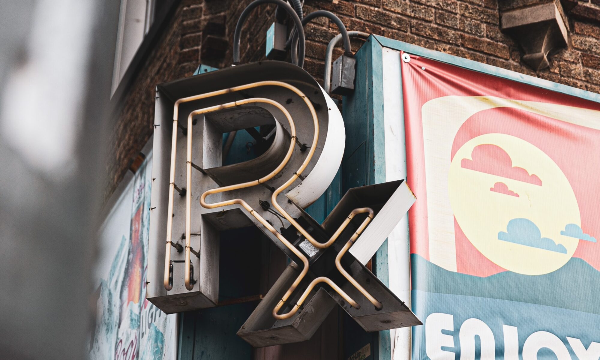 Rx sign on brick building